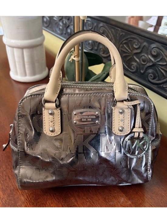 Michael Kors Handbags - Michael Kors Metallic Silver Mini
Satchel w/Monogram MK Charm